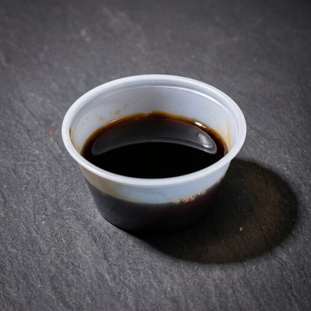 Soy sauce side cup.